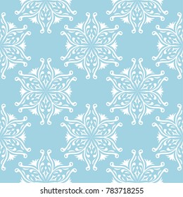 White flowers on blue background. Ornamental seamless pattern for textile and wallpapers