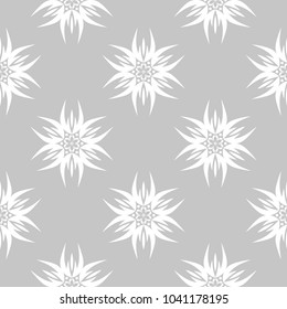 White flowers on gray background. Ornamental seamless pattern for textile and wallpapers