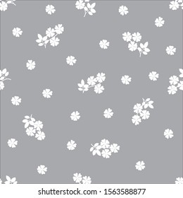 White flowers on a gray background. Seamless pattern. It can be used for fabrics.