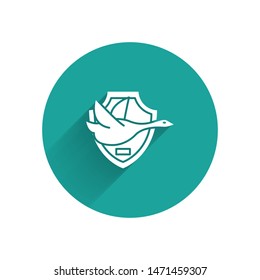 White Flying duck on shield icon isolated with long shadow. Hunting trophy on wall. Green circle button. Vector Illustration