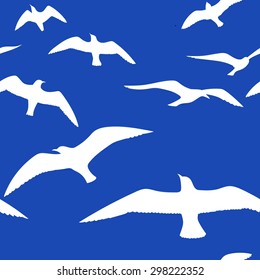 White Flying Seagull birds silhouettes on the blue sky background. Vector graphic seamless pattern.