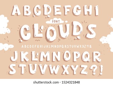 White font clouds on the beige background. Vector letters set