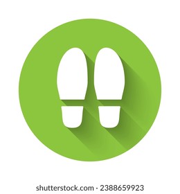 White Footsteps icon isolated with long shadow background. Detective is investigating. To follow in the footsteps. Green circle button. Vector