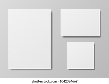 White frame banners with shadows on the gray background. Vector illustration. White paper cards template. Realistic vector mock up. Paper sheets