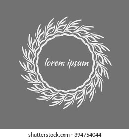 white frame of leaves on grey background