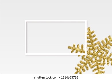 White frame over golden snowflake on light background. Vector winter holiday background