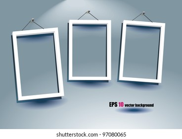 white frames on the gray wall