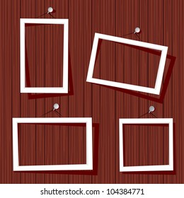 white frames on wooden wall. vector illustration.