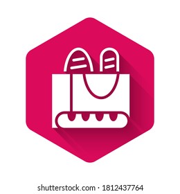 White French baguette bread icon isolated with long shadow. Pink hexagon button. Vector.