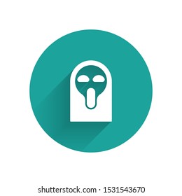 White Funny and scary ghost mask for Halloween icon isolated with long shadow. Happy Halloween party. Green circle button. Vector Illustration