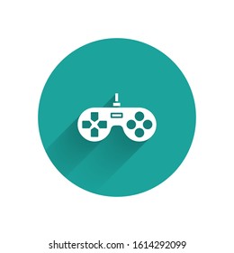 White Gamepad icon isolated with long shadow. Game controller. Green circle button. Vector Illustration