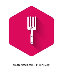 White Garden fork icon isolated with long shadow. Pitchfork icon. Tool for horticulture, agriculture, farming. Pink hexagon button. Vector Illustration
