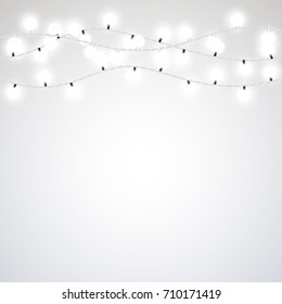 White garland style Christmas lights on the gray background. Vector design element.