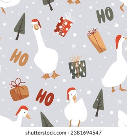 White geese in Santa Claus helper hats, gift boxes, and ho-ho-ho lettering seamless pattern. Funny and cute Xmas geese background, vector.