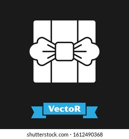 White Gift box icon isolated on black background.  Vector Illustration