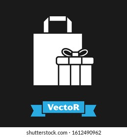 White Gift box icon isolated on black background.  Vector Illustration