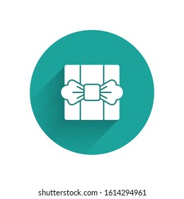 White Gift box icon isolated with long shadow. Green circle button. Vector Illustration
