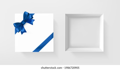 Caja blanca de regalo abierta y cerrada con cinta azul y arco