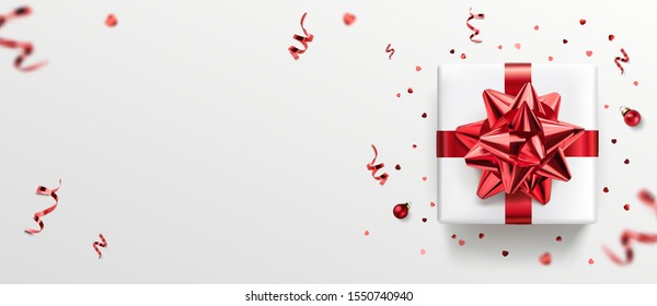White gift box with red ribbon and bow, red decoration, sparkles, confetti on white background. Merry Christmas and Xmas card. Happy Birthday postcard, top view, realistic vector