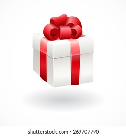 White gift box with red ribbon bow, isolated on white