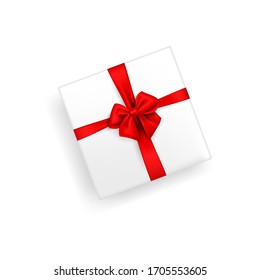 White gift box tied with silk or satin ribbon. Vector isolated stock illustration of a gift with a red bow on a white background in a realistic style. The view from the top. flat lay