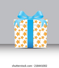 white Gift box  with a yellow star pattern tie blue ribbons 
