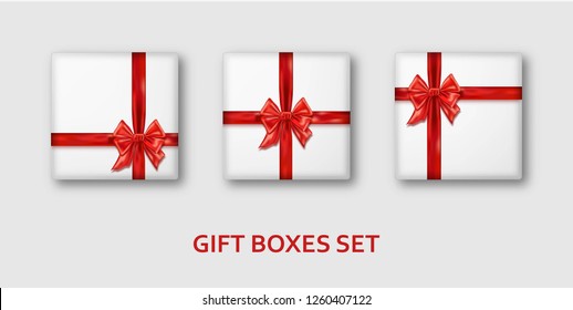 White gift boxes with red ribbons and bows. Realistic presents isolated on white background. Vector illustration