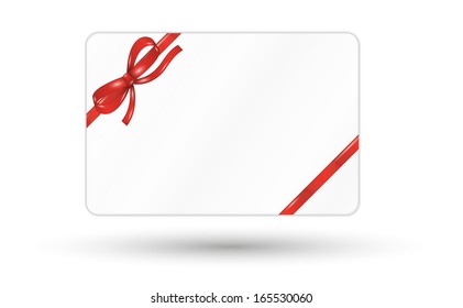 white gift card with red ribbon and bow on white background