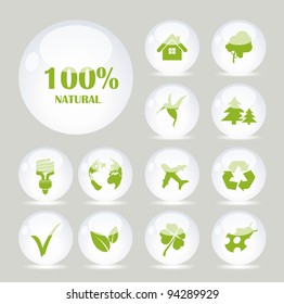 White glass balls with green symbols