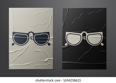 White Glasses icon isolated on crumpled paper background. Eyeglass frame symbol. Paper art style. Vector Illustration