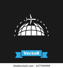 White Globe with flying plane icon isolated on black background. Airplane fly around the planet earth. Aircraft world icon.  Vector Illustration