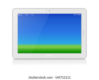 White glossy tablet personal computer in horizontal orientation of display. Green grass and blue sky as screen background. Copy space.