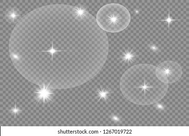 White glowing light explodes on a transparent background. Sparkling magical dust particles. Bright Star. Transparent shining sun, bright flash. Vector sparkles. To center a bright flash