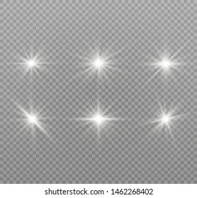 White glowing light explodes on a transparent background. Sparkling magical dust particles. Bright Star. Transparent shining sun, bright flash