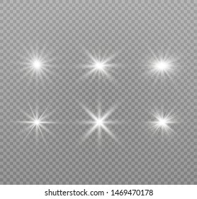 White glowing light explodes on a transparent background. Sparkling magical dust particles. Bright Star. Transparent shining sun, bright flash
