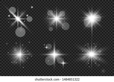 White glowing light explodes on a transparent background. Sparkling magical dust particles. Set of Bright Star. Transparent shining sun, bright flash Vector sparkles To center a bright flash Christmas