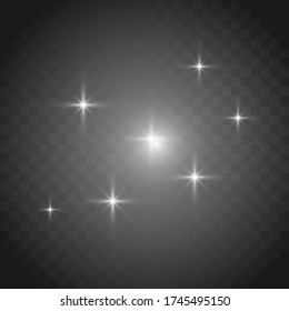 White glowing light explodes on a transparent background. Sparkling magical dust particles. Bright Star. Vector sparkles. To center a bright flash.