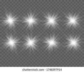 White glowing light explodes on a transparent background. Sparkling magical dust particles. Bright Star. Transparent shining sun, bright flash. Vector sparkles.