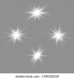 White glowing light explodes on a transparent background. Sparkling magical dust particles. Bright Star. Transparent shining sun, bright flash. To center a bright flash.