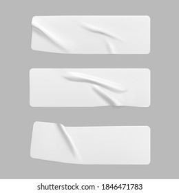 White glued crumpled rectangle stickers mock up set. Blank white adhesive paper or plastic sticker label with wrinkled and creased effect. Template label tags close up. 3d realistic vector