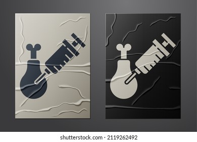 White Gmo research chicken icon isolated on crumpled paper background. Syringe being injected to chicken. Paper art style. Vector