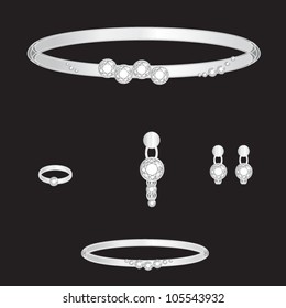 white gold set from necklace ring earrings brooch and bracelets with white brilliants on black background