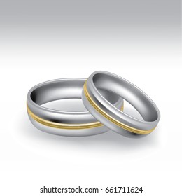 White gold wedding rings in pair with yellow gold ornament - isolated on white background