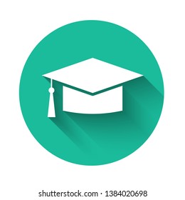 White Graduation cap icon isolated with long shadow. Graduation hat with tassel icon. Green circle button. Vector Illustration