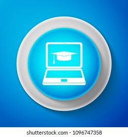 White Graduation cap and laptop icon isolated on blue background. Online learning or e-learning concept icon. Circle blue button with white line. Vector Illustration