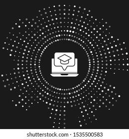 White Graduation cap on screen laptop icon isolated on grey background. Online learning or e-learning concept. Abstract circle random dots. Vector Illustration