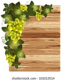White grapes on a wooden background with space for your text