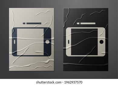 White Graphic tablet icon isolated on crumpled paper background. Paper art style. Vector Illustration