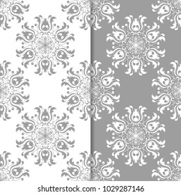 White and gray floral backgrounds. Set of seamless patterns for textile and wallpapers