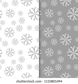 White and gray floral backgrounds. Set of seamless patterns for textile and wallpapers